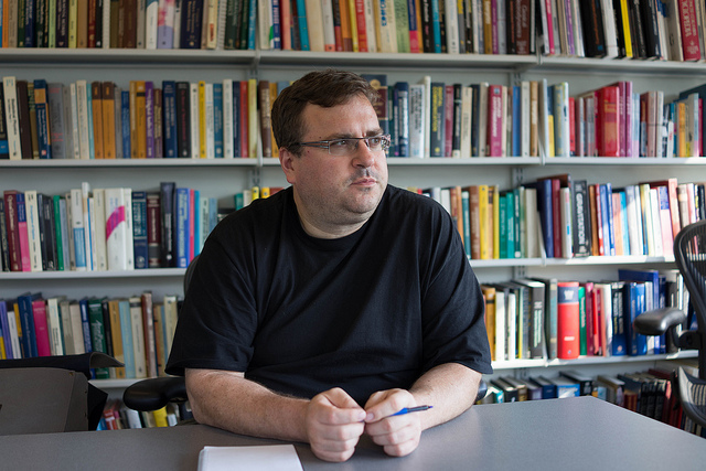 Reid Hoffman Founder of LinkedIn sitting at table